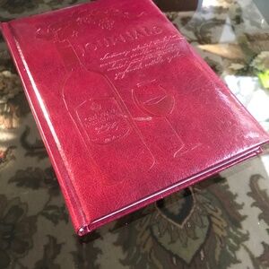 A wine journal book with a leather-like cover.